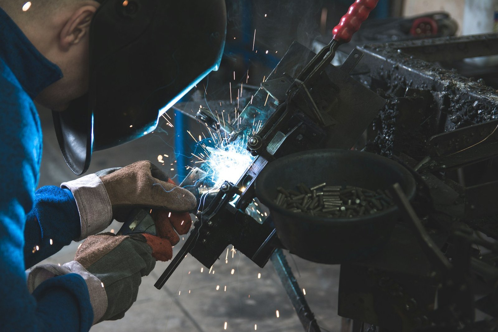 A welder working with metal, showing an industrial use for materials